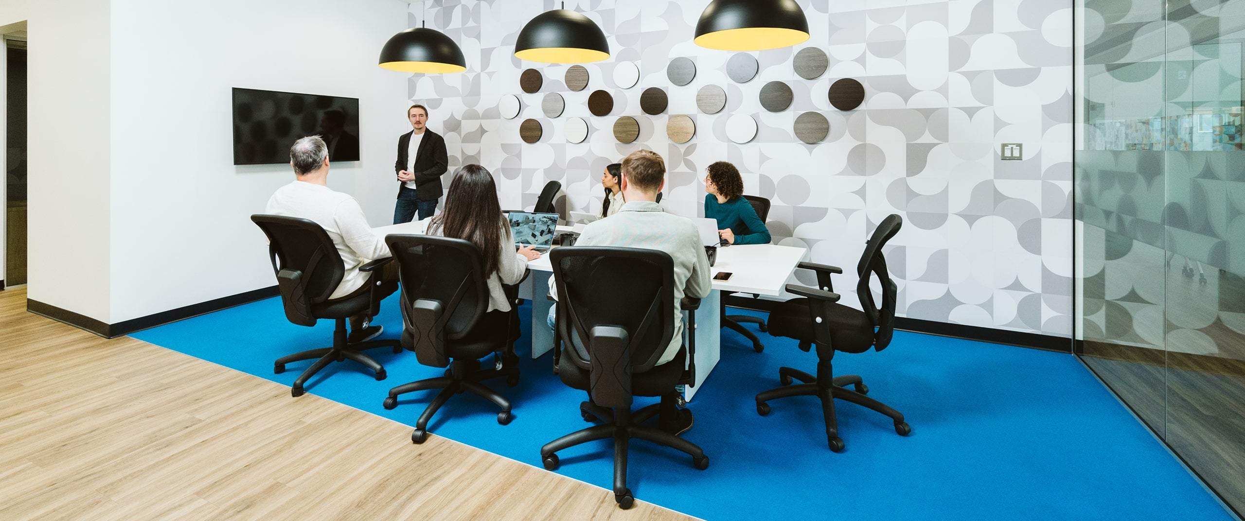 Employees seating at a conference table 